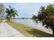 Walkway view of pond with grassy shoreline and lake at 1219 Club Cir, Lakeshore, FL 33854