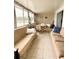 Relaxing sunroom with tile flooring and views of the lake at 1219 Club Cir, Lakeshore, FL 33854