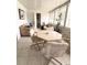 Bright sunroom with tile flooring, multiple windows, and comfortable seating at 1219 Club Cir, Lakeshore, FL 33854
