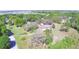 Expansive property featuring a home nestled among mature trees, offering privacy and a serene setting at 122 Wgto Tower Rd, Lake Alfred, FL 33850