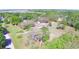 An aerial perspective highlights the property's large lot size and its proximity to mature trees at 122 Wgto Tower Rd, Lake Alfred, FL 33850