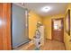 Basement with yellow walls and tile flooring and a door leading outside at 122 Wgto Tower Rd, Lake Alfred, FL 33850