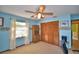 Light blue bedroom featuring a ceiling fan, window and a light carpet at 122 Wgto Tower Rd, Lake Alfred, FL 33850