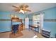 Blue toned bedroom featuring carpet, ceiling fan and a desk at 122 Wgto Tower Rd, Lake Alfred, FL 33850