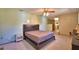 Bedroom featuring a ceiling fan, carpeted floors, and a double-casement window at 122 Wgto Tower Rd, Lake Alfred, FL 33850