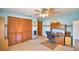 Blue toned bedroom featuring closet, carpet and desk at 122 Wgto Tower Rd, Lake Alfred, FL 33850