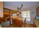 Charming breakfast nook with a window view, cozy seating, and unique wallpaper at 122 Wgto Tower Rd, Lake Alfred, FL 33850