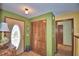 Entryway with closet, decorative glass front door, and unique wall decor at 122 Wgto Tower Rd, Lake Alfred, FL 33850