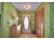 Entryway with closet, decorative glass front door, and unique wall decor at 122 Wgto Tower Rd, Lake Alfred, FL 33850