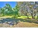 Large yard with mature trees and plenty of room at 122 Wgto Tower Rd, Lake Alfred, FL 33850