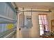 Garage interior with a GENERAC switch box and garage door track at 122 Wgto Tower Rd, Lake Alfred, FL 33850
