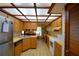 Well-lit kitchen with light wood cabinets, tiled floors, and a skylight roof at 122 Wgto Tower Rd, Lake Alfred, FL 33850