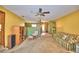 Spacious living room with a unique stepped entry and a ceiling fan at 122 Wgto Tower Rd, Lake Alfred, FL 33850