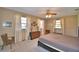 Main bedroom features a ceiling fan, carpet floors and three windows at 122 Wgto Tower Rd, Lake Alfred, FL 33850