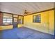 Enclosed patio with a ceiling fan and a full view of the backyard at 122 Wgto Tower Rd, Lake Alfred, FL 33850