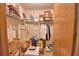 View into cluttered walk-in closet with wire shelving and storage boxes at 122 Wgto Tower Rd, Lake Alfred, FL 33850