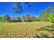 Vast green space surrounding the home, perfect for outdoor activities and enjoying nature at 122 Wgto Tower Rd, Lake Alfred, FL 33850