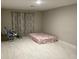 Spacious room features a soft bed and chair with soft lighting and neutral decor for a peaceful ambiance at 1393 Axel Cir, Winter Haven, FL 33880