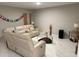 Comfortable living room featuring a stylish leather sectional, modern décor, and ample natural light at 1393 Axel Cir, Winter Haven, FL 33880