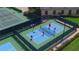 Aerial view of active pickleball courts, showcasing the community's recreational amenities and outdoor activities at 1402 Colonial Ct, Winter Haven, FL 33884