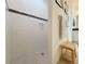 Walk-in shower in a bathroom with tiled walls, modern fixtures, and convenient bench seating at 1402 Colonial Ct, Winter Haven, FL 33884