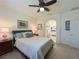 Comfortable bedroom leading to an en-suite bathroom, offering convenience and privacy at 1402 Colonial Ct, Winter Haven, FL 33884