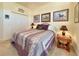 Cozy bedroom with a comfortable bed, side tables with lamps, and horse-themed decor at 1402 Colonial Ct, Winter Haven, FL 33884