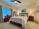 Serene bedroom with a comfortable bed, dresser, and stylish decor creating a peaceful atmosphere at 1402 Colonial Ct, Winter Haven, FL 33884