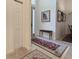 Inviting entryway with a decorative rug, bench seating, and ample natural light from the front door at 1402 Colonial Ct, Winter Haven, FL 33884