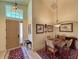 Entry way featuring dining room table, decor and front door with sidelight at 1402 Colonial Ct, Winter Haven, FL 33884
