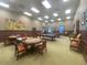 A spacious game room features pool tables, card tables, and comfortable seating for leisurely activities at 1402 Colonial Ct, Winter Haven, FL 33884
