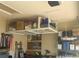 Garage featuring overhead storage rack at 1402 Colonial Ct, Winter Haven, FL 33884
