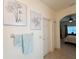 Hallway leading to a bedroom featuring stylish decor and ample lighting at 1402 Colonial Ct, Winter Haven, FL 33884