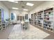 A serene library with bookshelves, tables, and chairs, creating a quiet space for reading and studying at 1402 Colonial Ct, Winter Haven, FL 33884