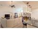 Spacious living room featuring an open floor plan, ceiling fan, and plenty of natural light at 1402 Colonial Ct, Winter Haven, FL 33884