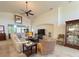 Comfortable open-concept living room featuring a sofa and entertainment center at 1402 Colonial Ct, Winter Haven, FL 33884