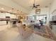 Inviting open-concept living room area featuring a kitchen and cozy seating arrangements at 1402 Colonial Ct, Winter Haven, FL 33884