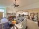 Bright and open living space connected to the dining area and kitchen, perfect for entertaining at 1402 Colonial Ct, Winter Haven, FL 33884