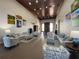 Grand lobby featuring stylish sofas, chairs, and tables, complemented by elegant decor and artwork at 1402 Colonial Ct, Winter Haven, FL 33884