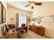 Comfortable office space complete with a desk, cabinets, and natural light from the window at 1402 Colonial Ct, Winter Haven, FL 33884