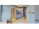 Bathroom with a double sink vanity and tile flooring with glass shower at 1409 Berkley Ct, Winter Haven, FL 33880