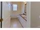 Cozy bathroom featuring tile flooring, a vanity with a sink, and a toilet at 1409 Berkley Ct, Winter Haven, FL 33880