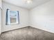 Cozy bedroom with a ceiling fan, carpet floor, and window at 1409 Berkley Ct, Winter Haven, FL 33880