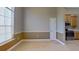 Bright dining area featuring tile flooring, natural light, and kitchen access at 1409 Berkley Ct, Winter Haven, FL 33880