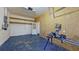 Spacious garage with shelving and ample space for storage and projects at 1409 Berkley Ct, Winter Haven, FL 33880