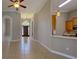 Open hallway featuring tile floors and arched doorways at 1409 Berkley Ct, Winter Haven, FL 33880