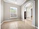 Inviting living room with archways, neutral paint, and large windows, offering ample natural light at 1409 Berkley Ct, Winter Haven, FL 33880