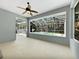 Enclosed patio with ceiling fan, tile floors, and a screened-in pool area at 1409 Berkley Ct, Winter Haven, FL 33880