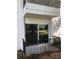 Balcony view with sliding glass door and black metal railing at 1550 11Th Ne St # A2, Winter Haven, FL 33881