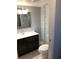 Bathroom featuring a stylish vanity, toilet, and modern fixtures, offering a comfortable experience at 1550 11Th Ne St # A2, Winter Haven, FL 33881